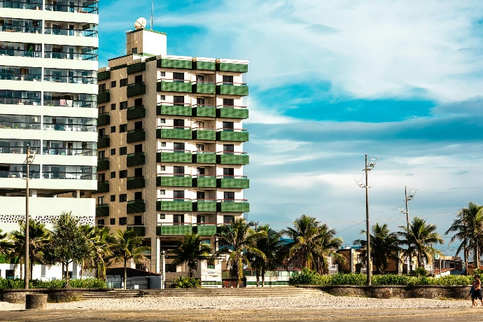 Apartment buildings with palm trees on a sunny day